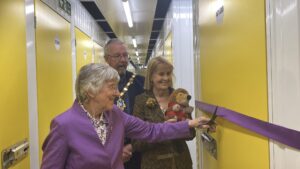 Sue Sollis Founder Member of Tracy Sollis Leukaemia Trust cutting ribbon to storage unit